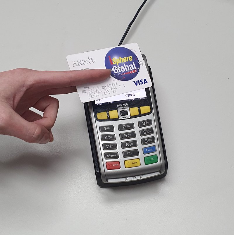 iSphere Global payment card being tapped on a terminal